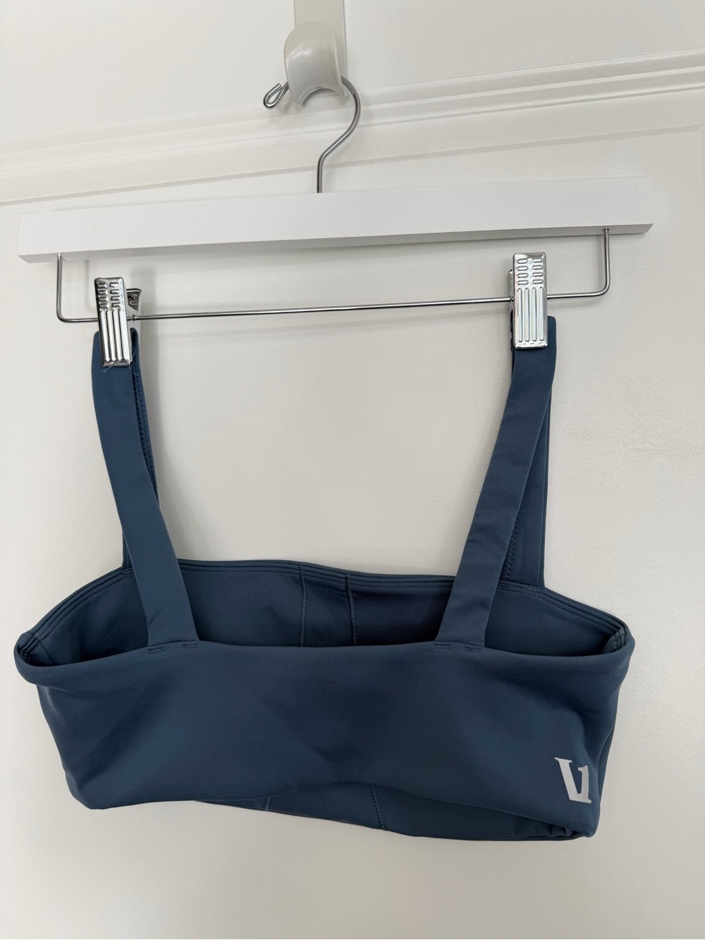 Vuori navy square neck sports bra with silver logo